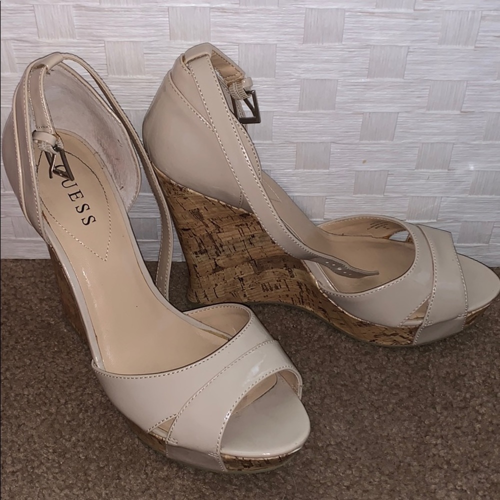 Gently used GUESS WOMANS cream wedge heel SZ.9